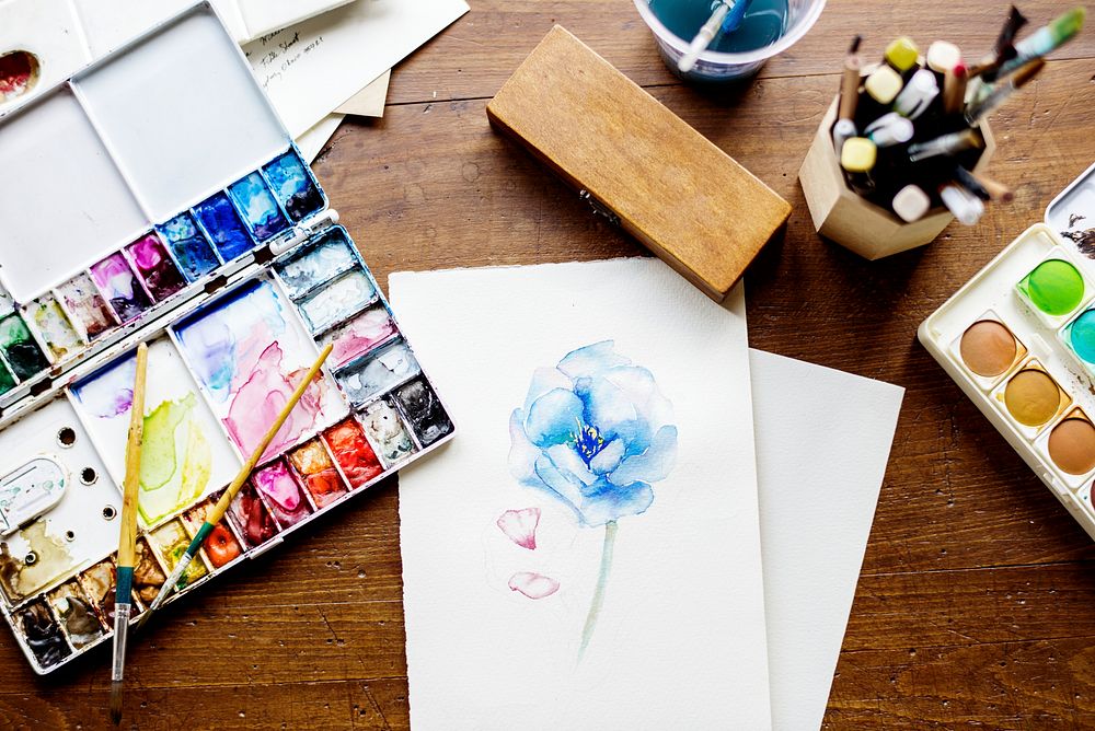 Flower watercolor painting on a table