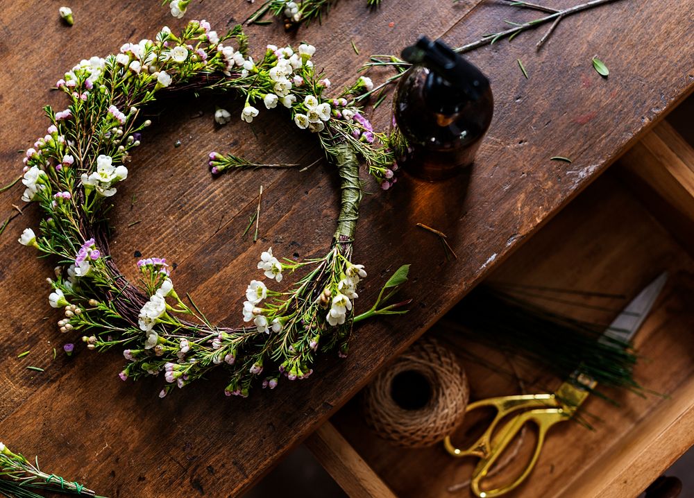 Floral wreath on a wooden table and drawer
