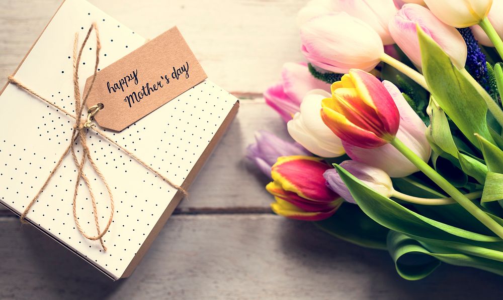Tulip Flowers and Mother Day Present on Wooden Background