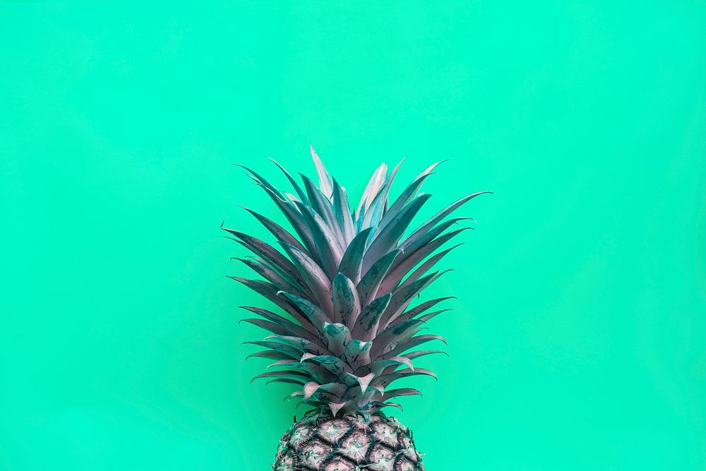 Pineapple with green background