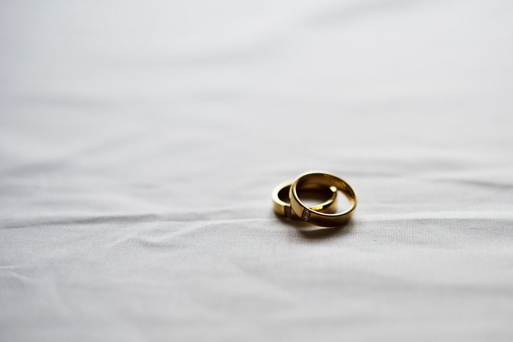 Two Gold Wedding Ring on White Background