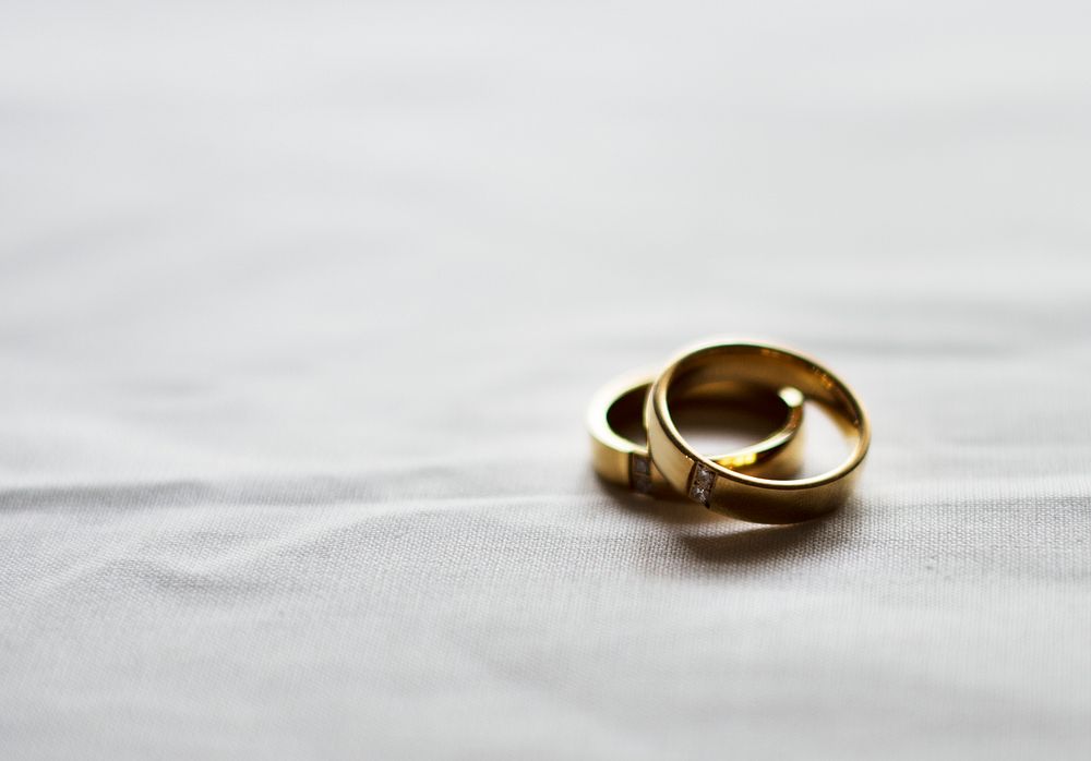 Two Gold Wedding Ring on White Background