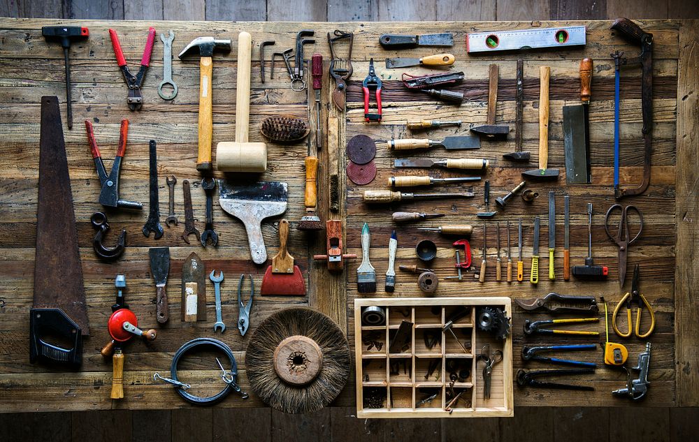 Aerial view of carpenter tools equipment set on wooden table