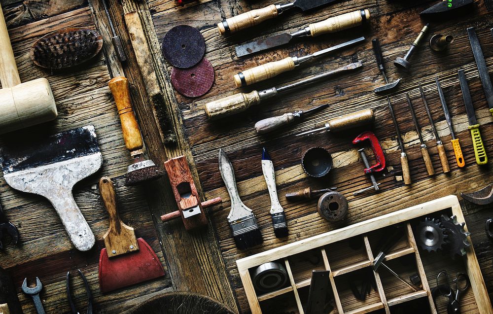 Aerial view of carpenter tools equipment set on wooden table