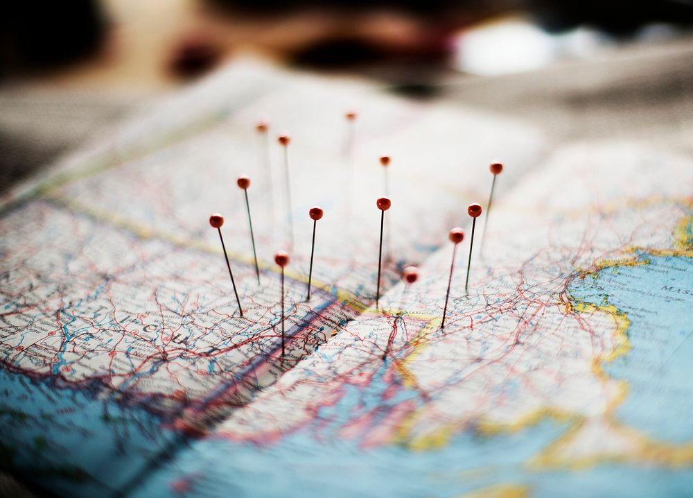 Closeup of pins on the map planning travel journey