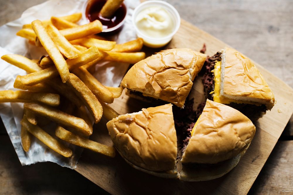 Junk food hamburger set on the wooden board