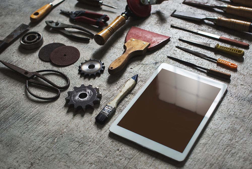 Digital tablet with tools on the table