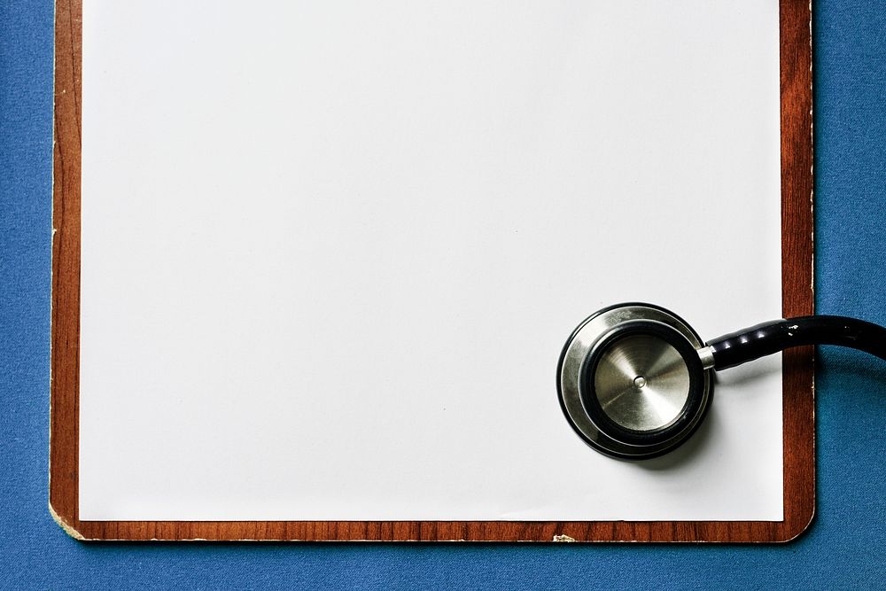 Closeup of a clipboard and a stethoscope