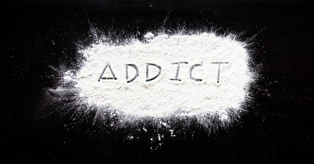 Addict powder word on black background