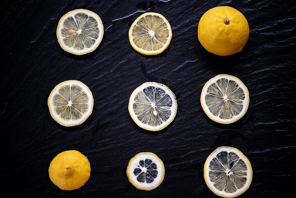 Sliced of yellow lemon in a row
