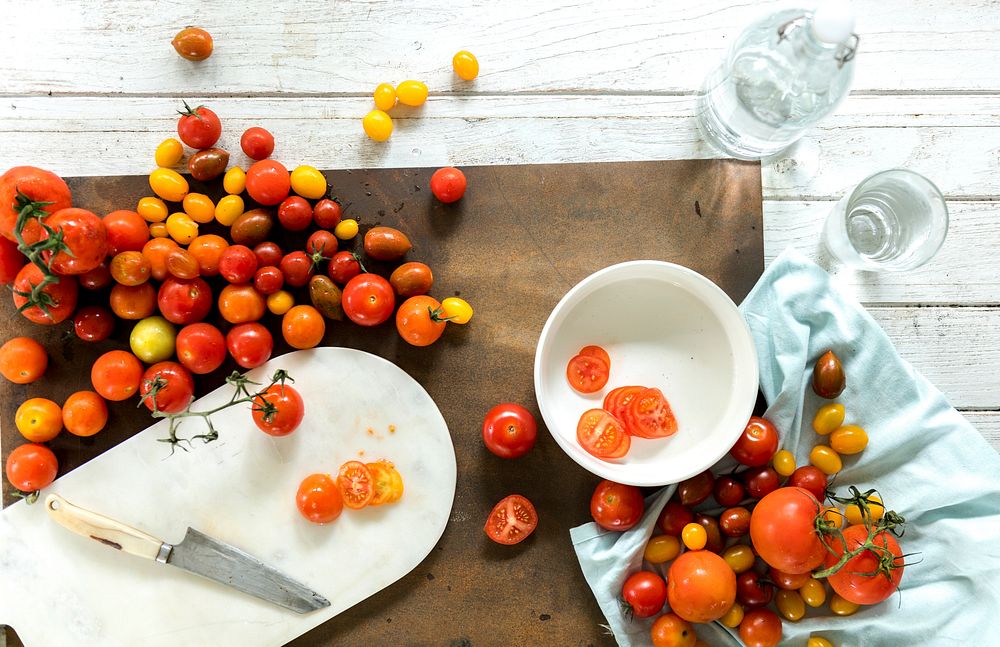 Fresh natural tomatoes on a cutting board