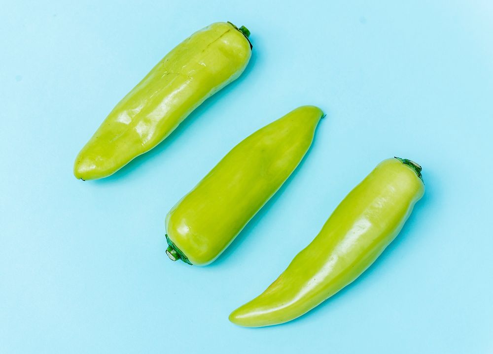 Jalapeno peppers on blue background
