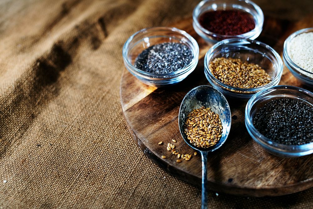 Aerial of seeds superfood on wooden board and spoon