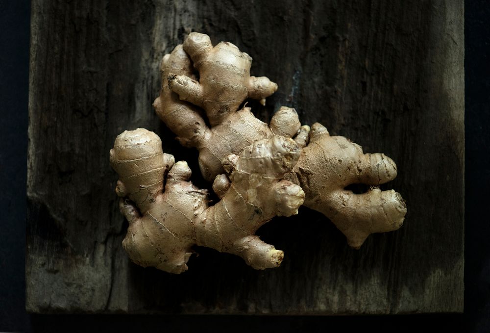 Closeup of ginger produce from farm on wooden textured