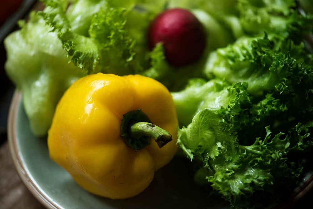 Closeup of sweet bell pepper and iceberg vegetable