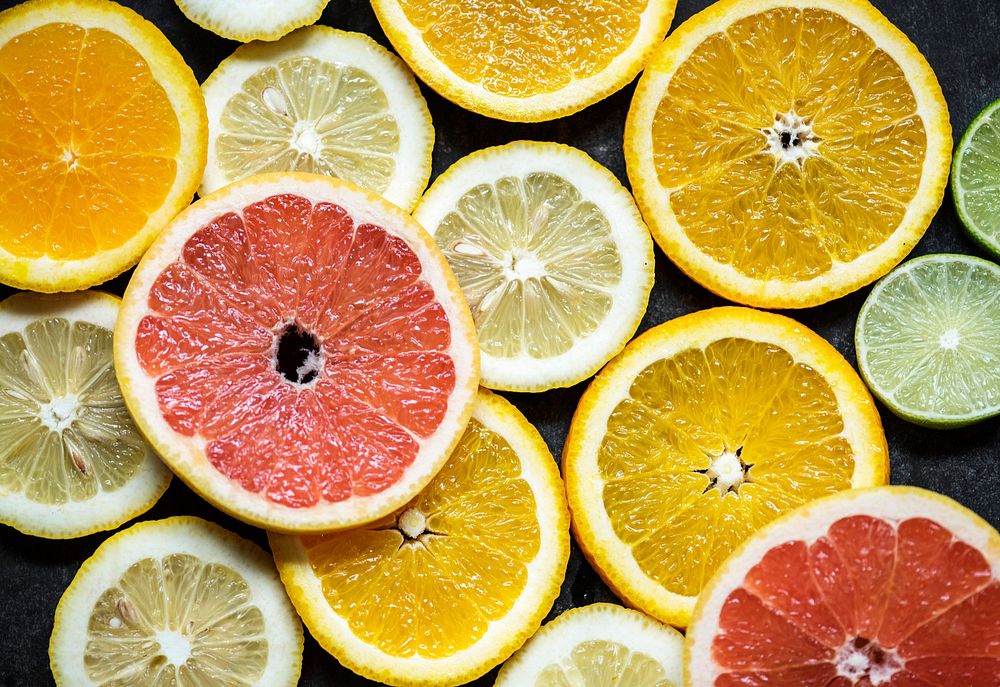 Closeup of fresh citrus fruit slices background