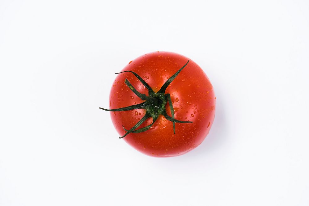 Closeup of fresh organic tomato isolated on white