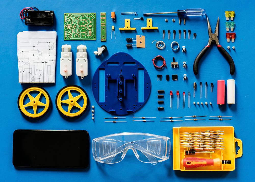Aerial view of electronics tools equipments on blue background