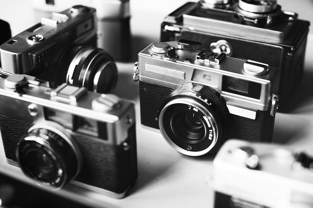Group of vintage film cameras grayscale