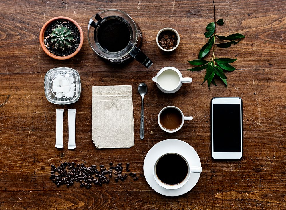 Aerial view of coffee setting on wooden table