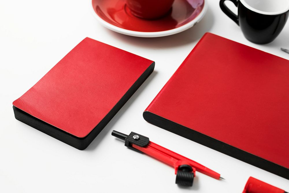 Closeup of red stationery on white table