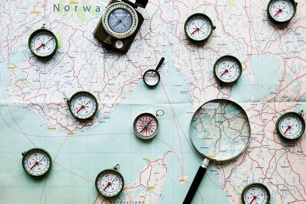 Compass and magnifier on a map