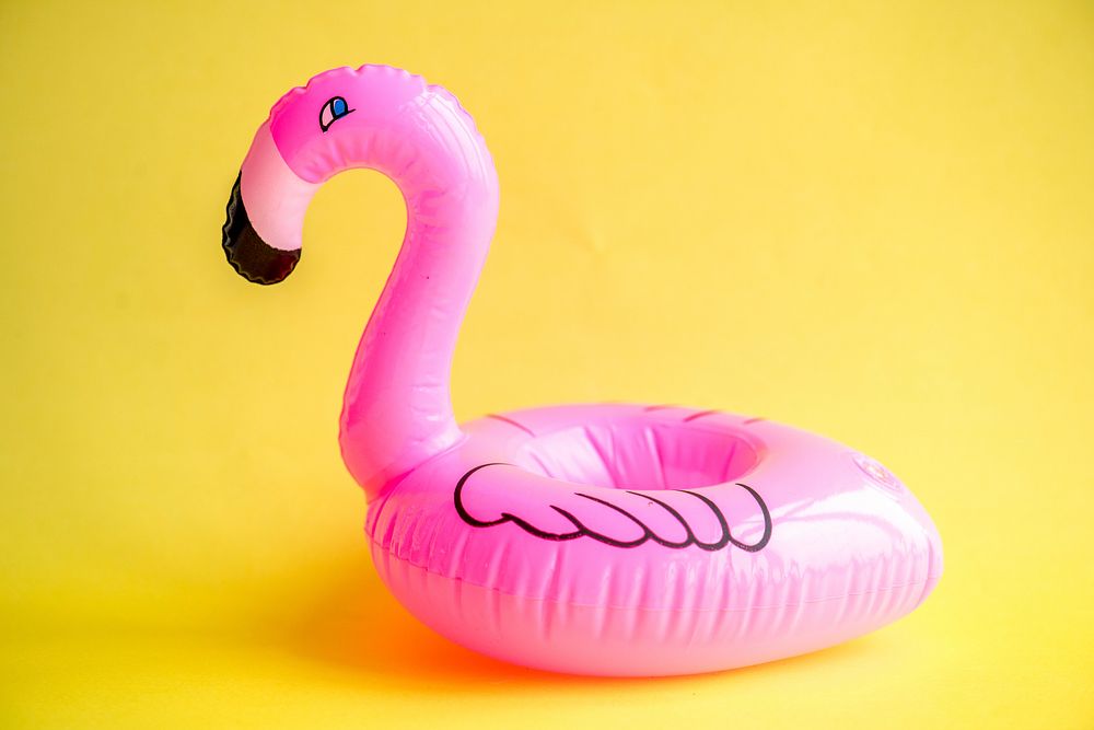 Flamingo inflatable on yellow background