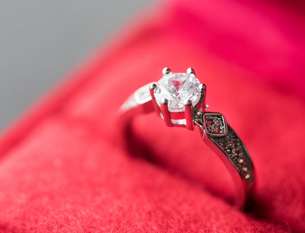 Closeup of diamond ring in red velvet box macro