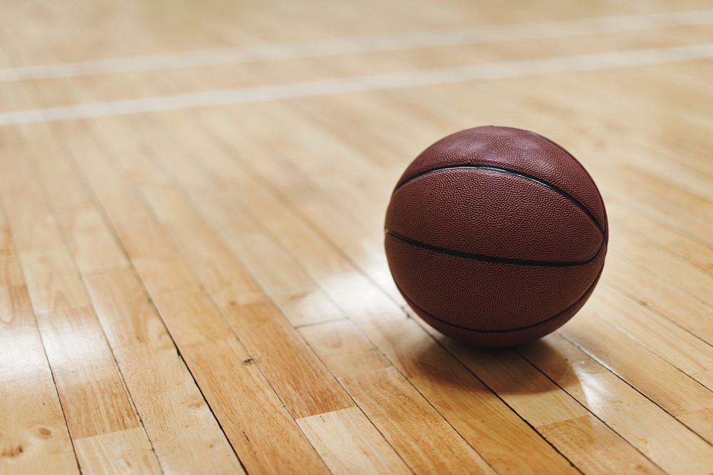 Basketball on wooden floor court