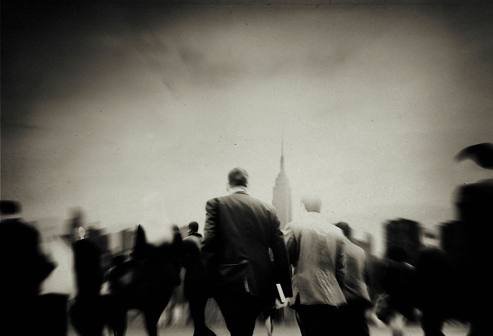 Abstract blurred business people commuting during rush hour black and white