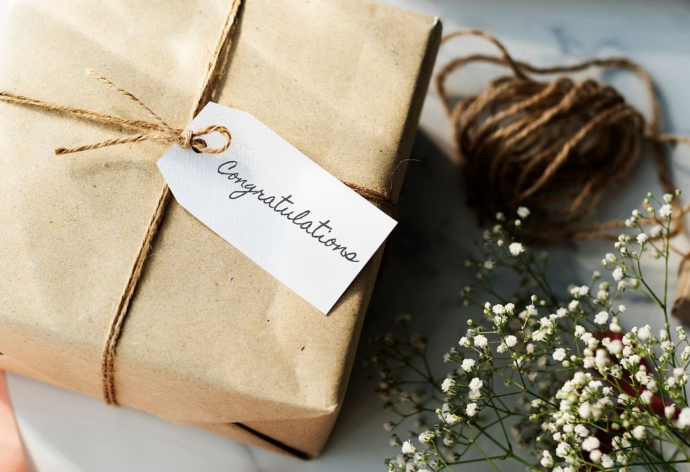 Rustic gift with congratulatory tag.