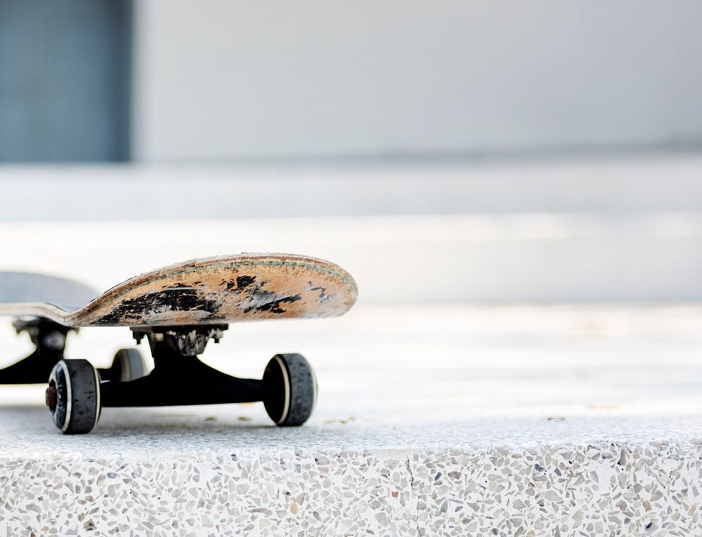 Closeup of skateboard on white floor