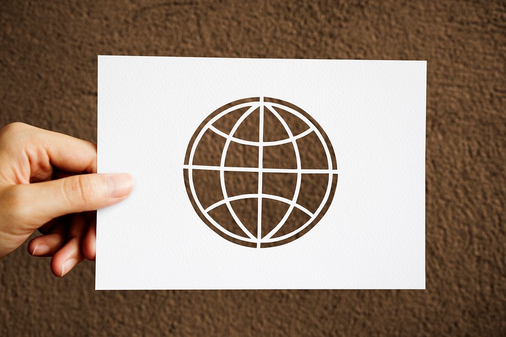 Hand Hold Globe Paper Carving with Brown Background