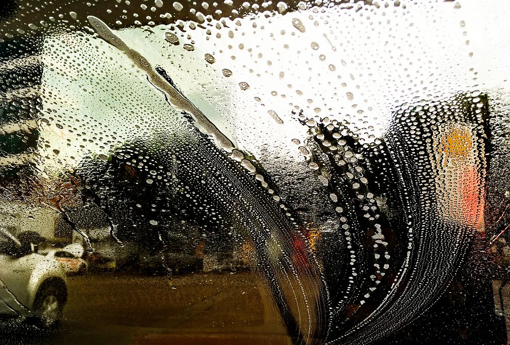 Soap wash streaks on a car windshield