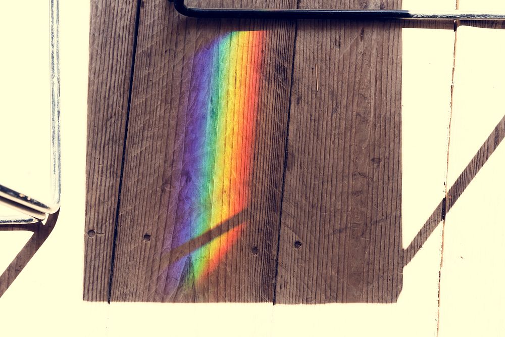 Rainbow reflect on the shadow of the chair
