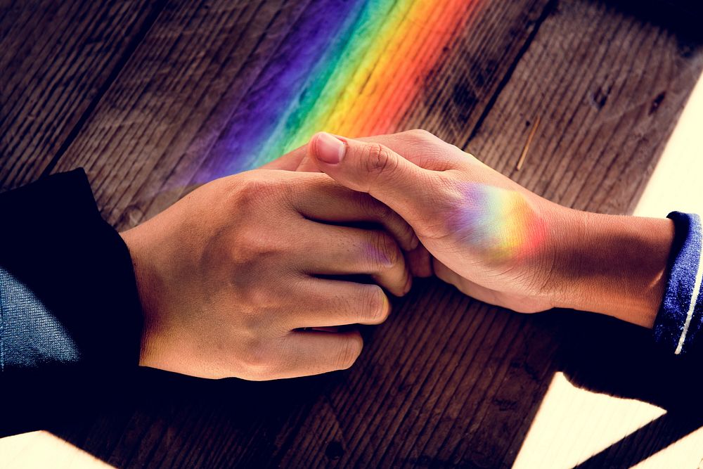 Hands Hold Together with Prism Lights