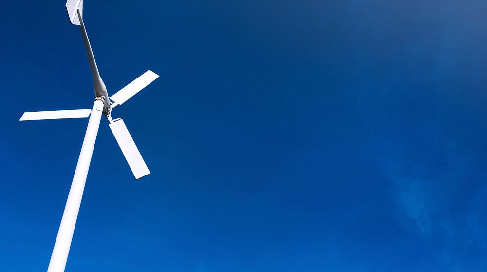 Wind turbine power generator with blue sky