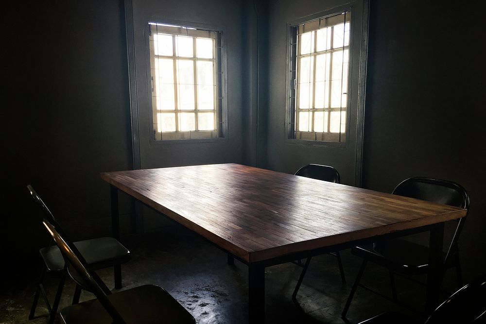 Dark small room with table and chair