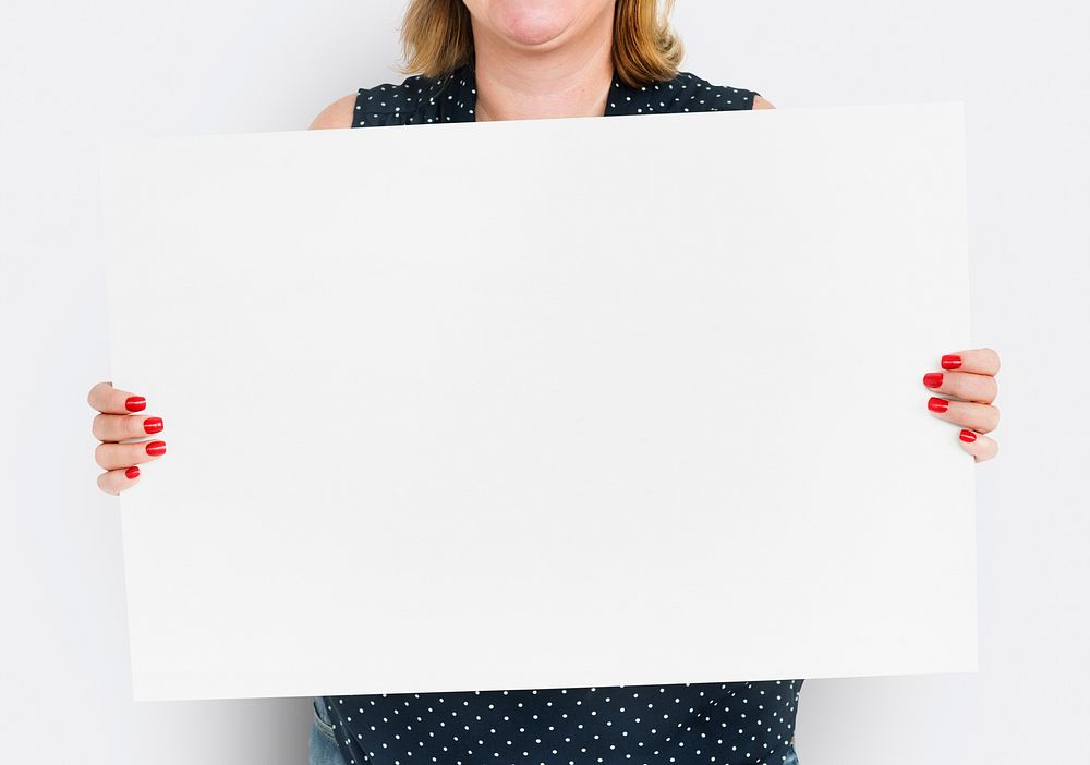 Woman holding blank white board