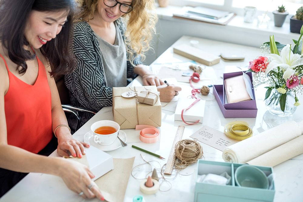 Woman wrapping present box