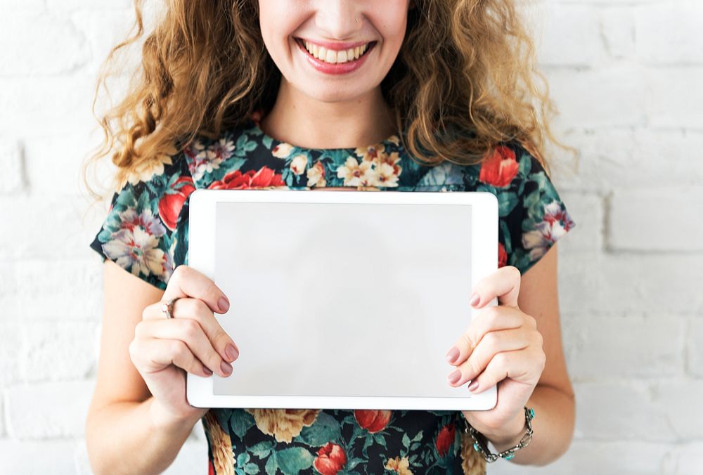 Caucasian woman holding digital tablet