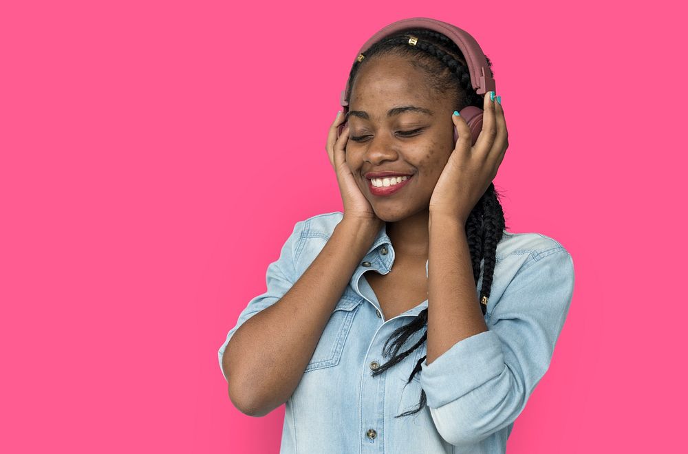 Young black girl listening to music headphones