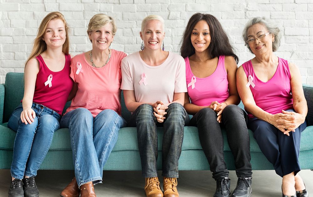 A group of diverse women with pink ribbon for breast cancer awareness