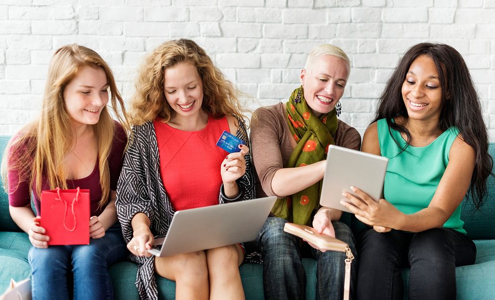A group of diverse women is shopping online