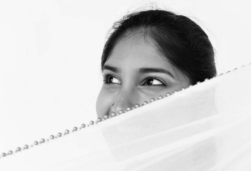 Indian girl covering face with chiffon portrait