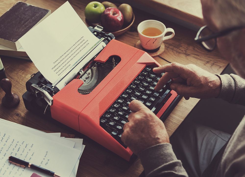 Senior typing on a typewriter