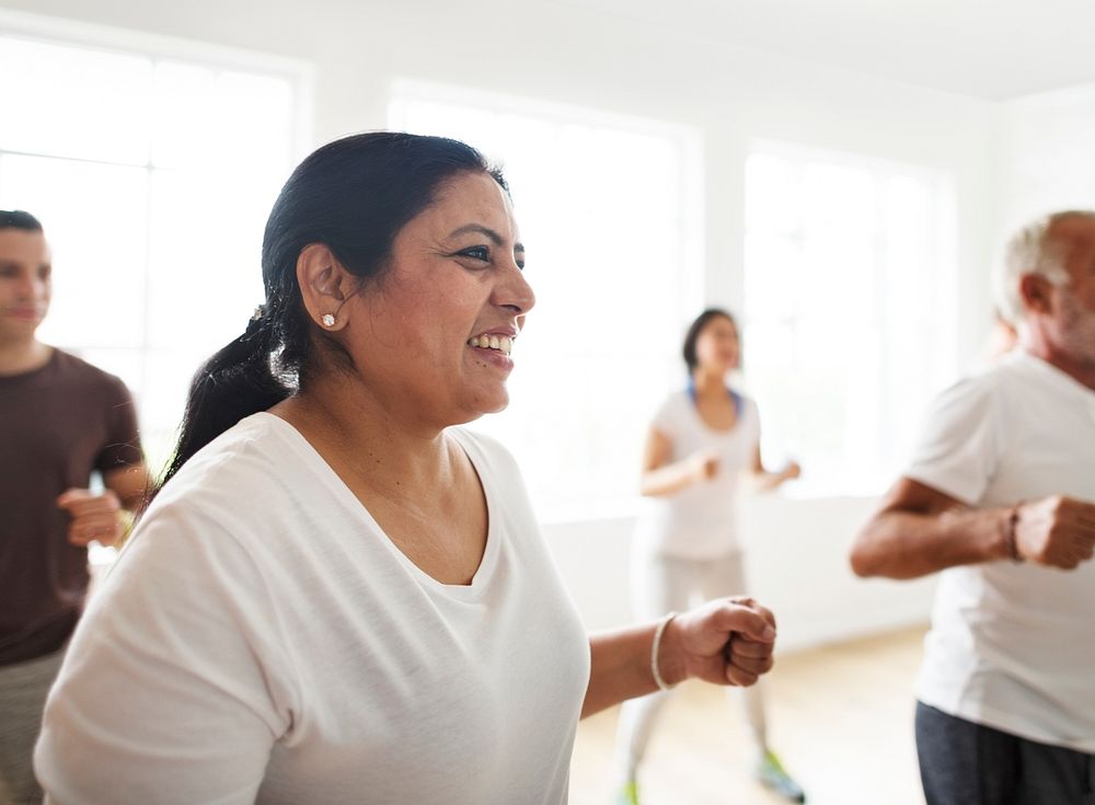 Closeup of an happy Indian woman in an excercise class