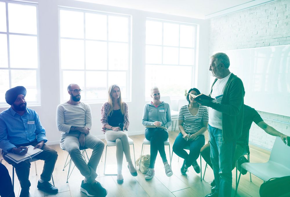 Student sitting in a class and teacher is teaching