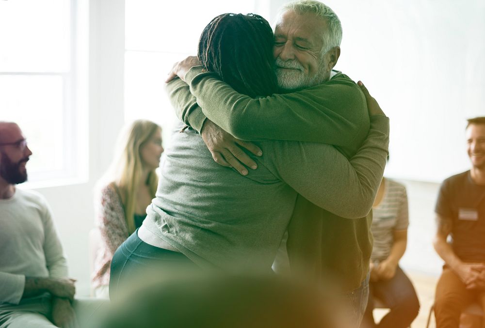 Couple hugging during an event