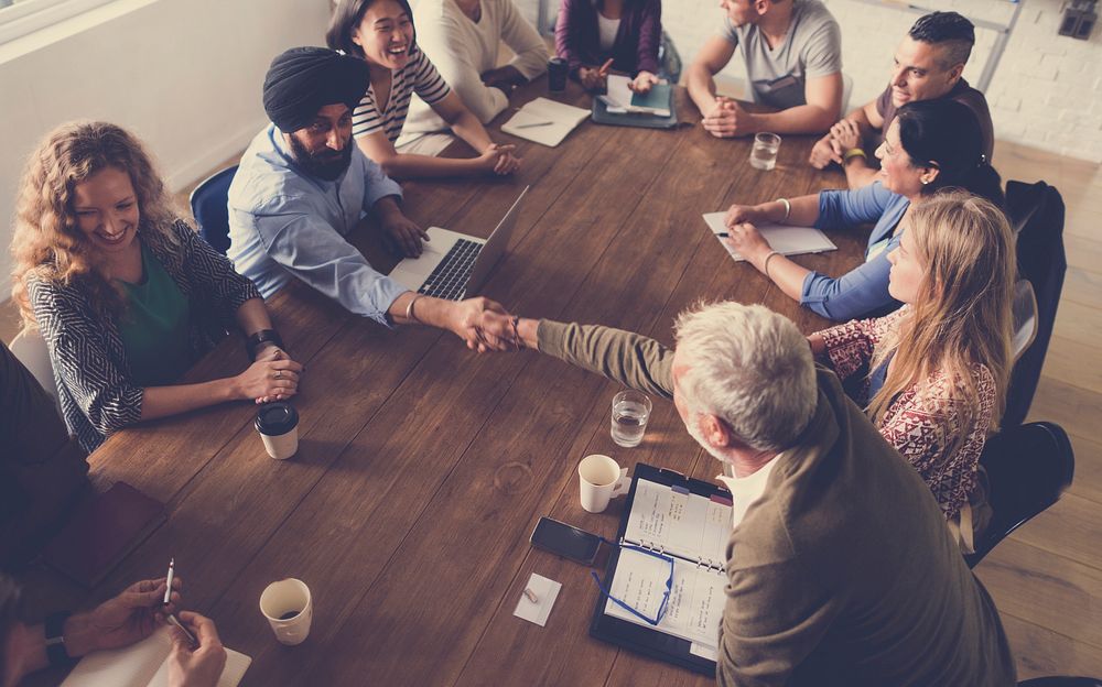 Diverse people teamwork on meeting table